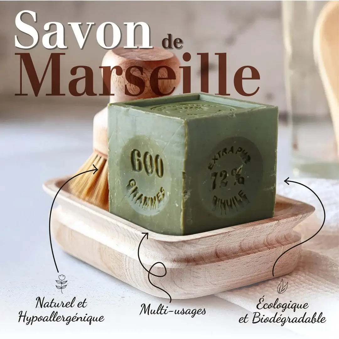 Green Marseille soap bar on a wooden tray with branding details.