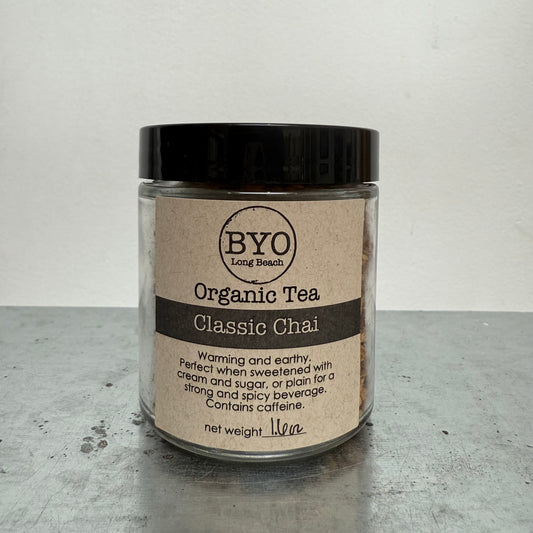 Jar of BYO Organic Tea Classic Chai on a gray surface with a white background