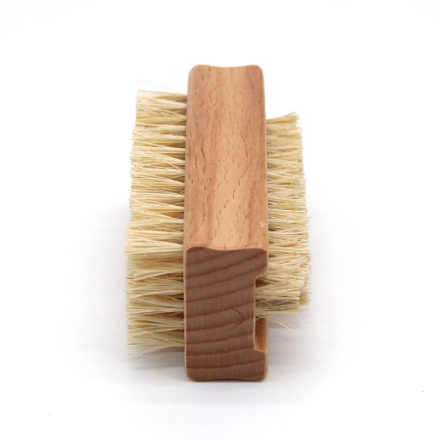 Wooden brush with bristles on a white background