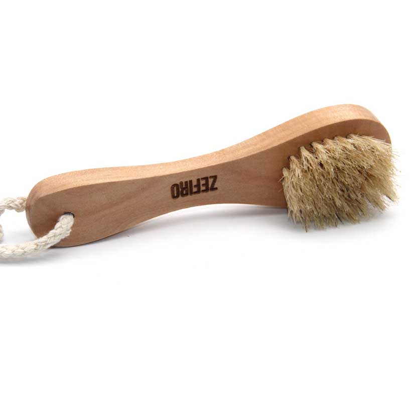 Wooden brush with bristles and rope handle on a white background, branded 'Zefro'.