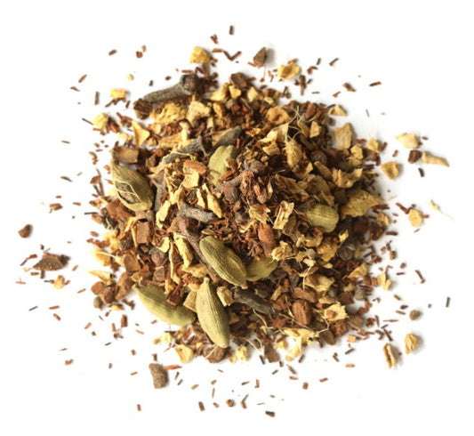 Spice blend with cardamom pods on a white background