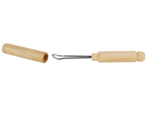 Wood holder with stainless steel curved wand for ear cleaning. Shown with lid off.