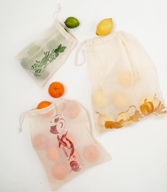 Set of 3 reusable produce bags holding fruits. Each bag is a light cotton gauze with a printed image. 3 pack includes a small, medium, and large bag, displayed on a white background.