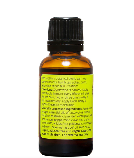 Bottle of essential oil blend with label on a white background