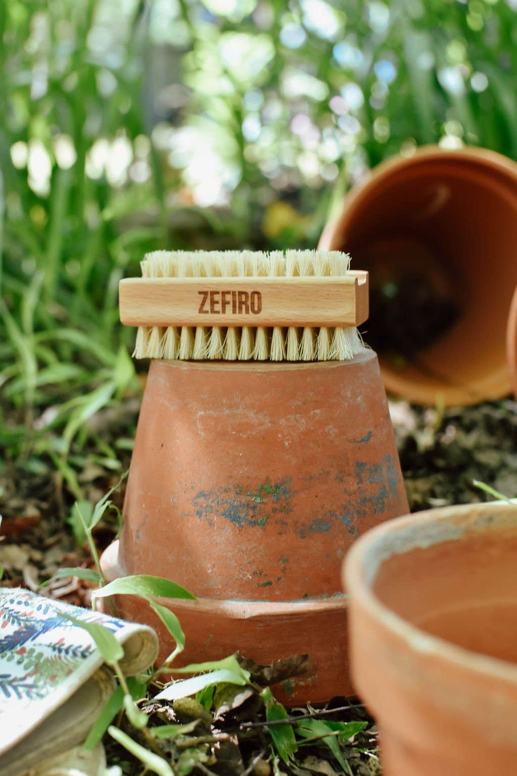 Branding of Zefiro on a terracotta pot with natural background