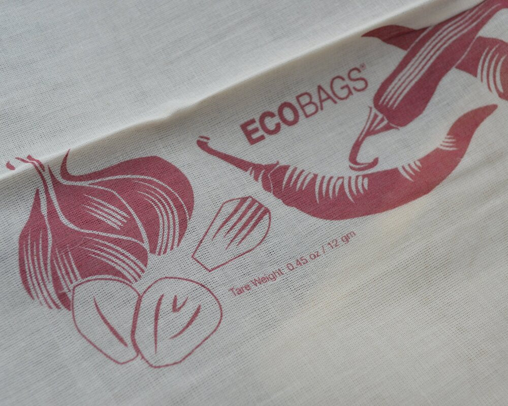 Close up of the cotton bag showing the tare weight of the bag and the printed veggies.