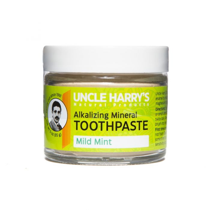 3 Ounce Glass jar with green label showing clay toothpaste