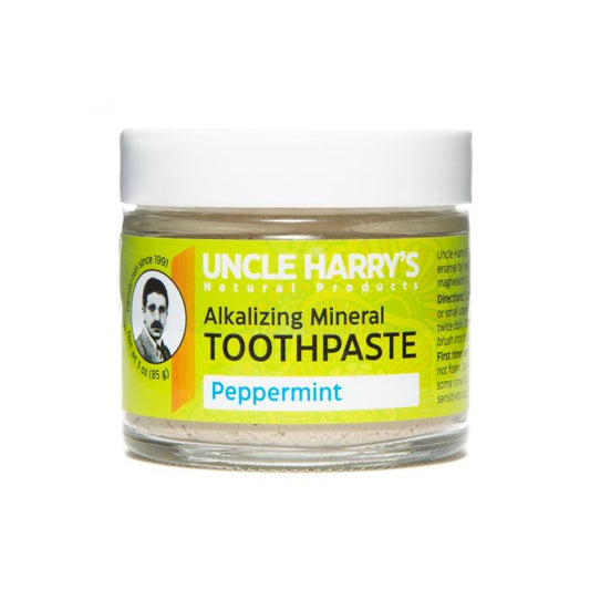 3 Ounce Glass jar with green label showing clay toothpaste