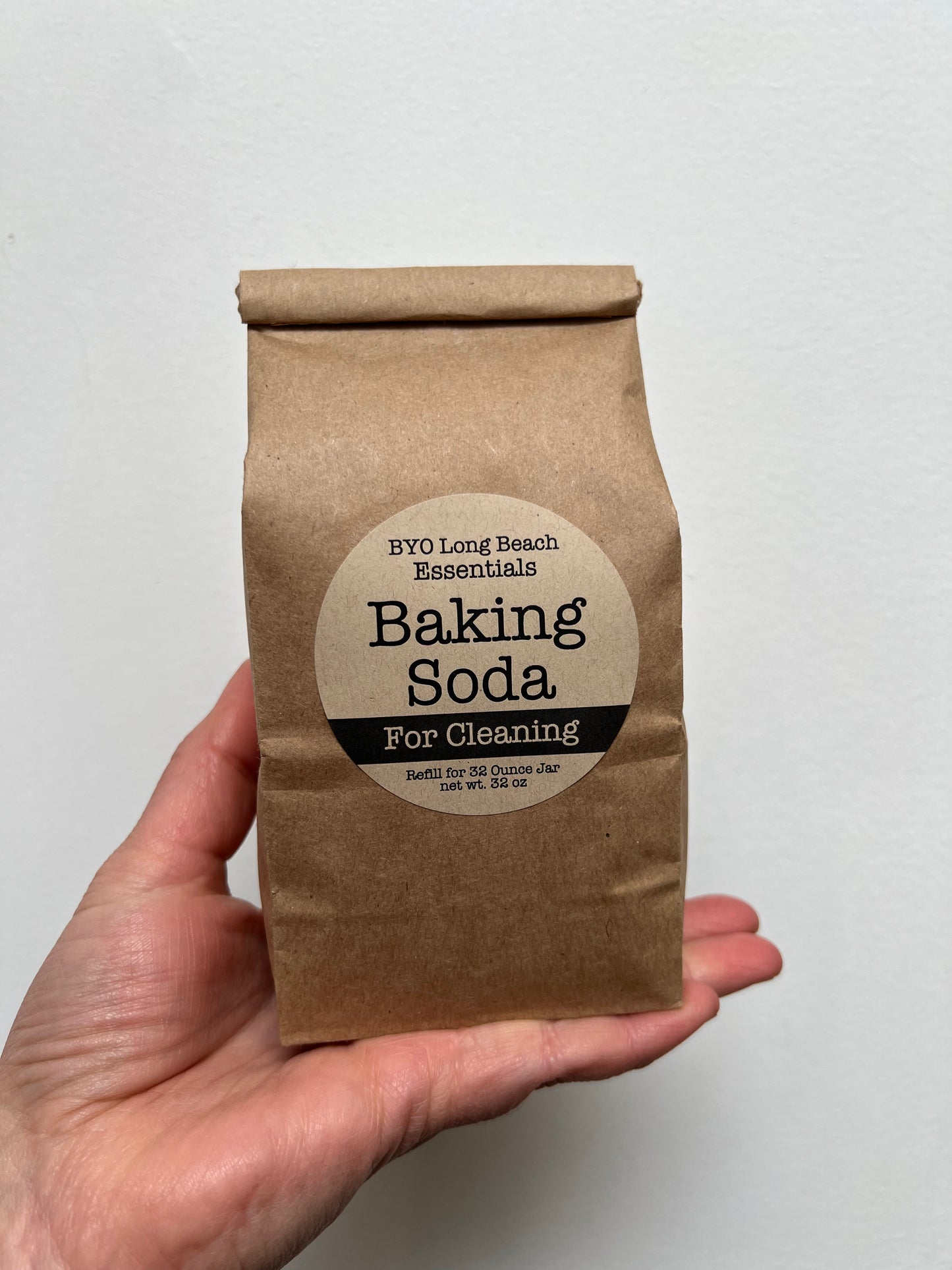 Brown paper bag with baking soda, twist tie closure