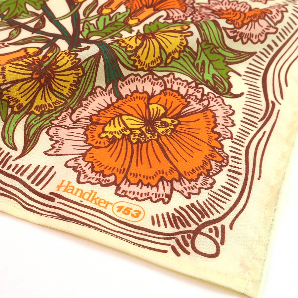 Floral patterned fabric with 'Handker 163' branding on a white background