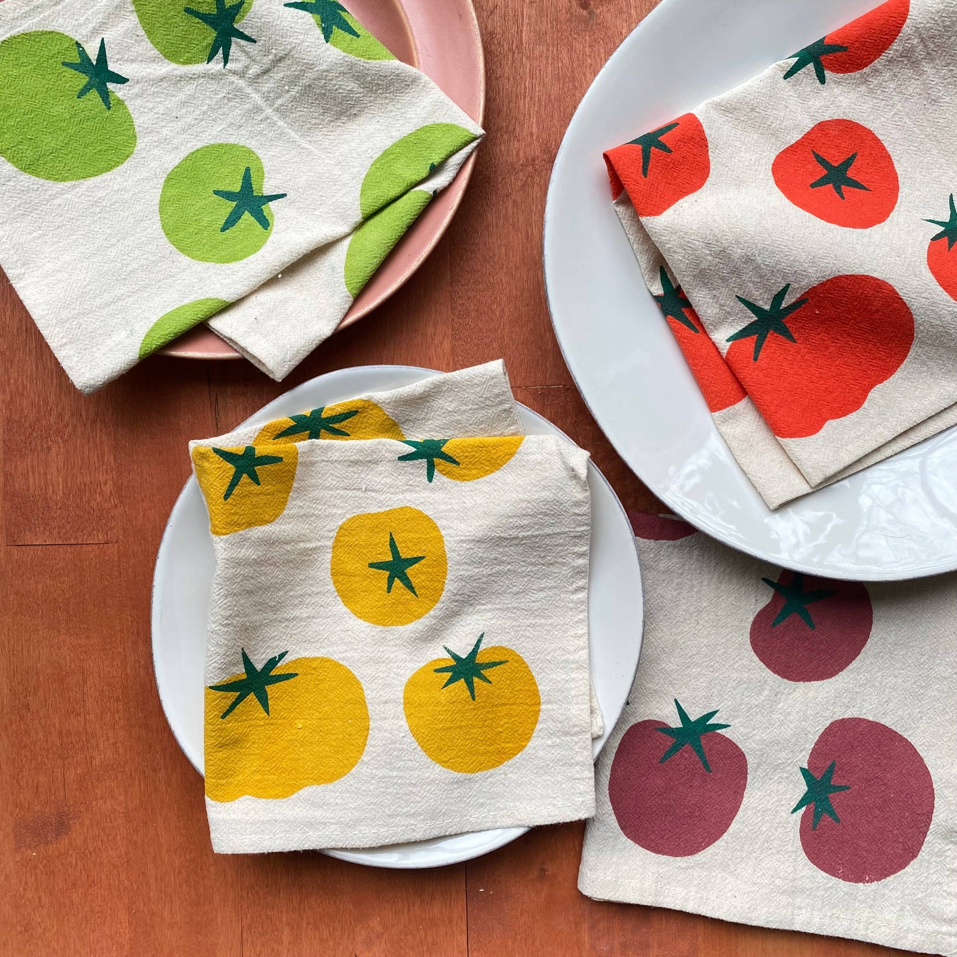 Napkins with tomato pattern on a wooden table
