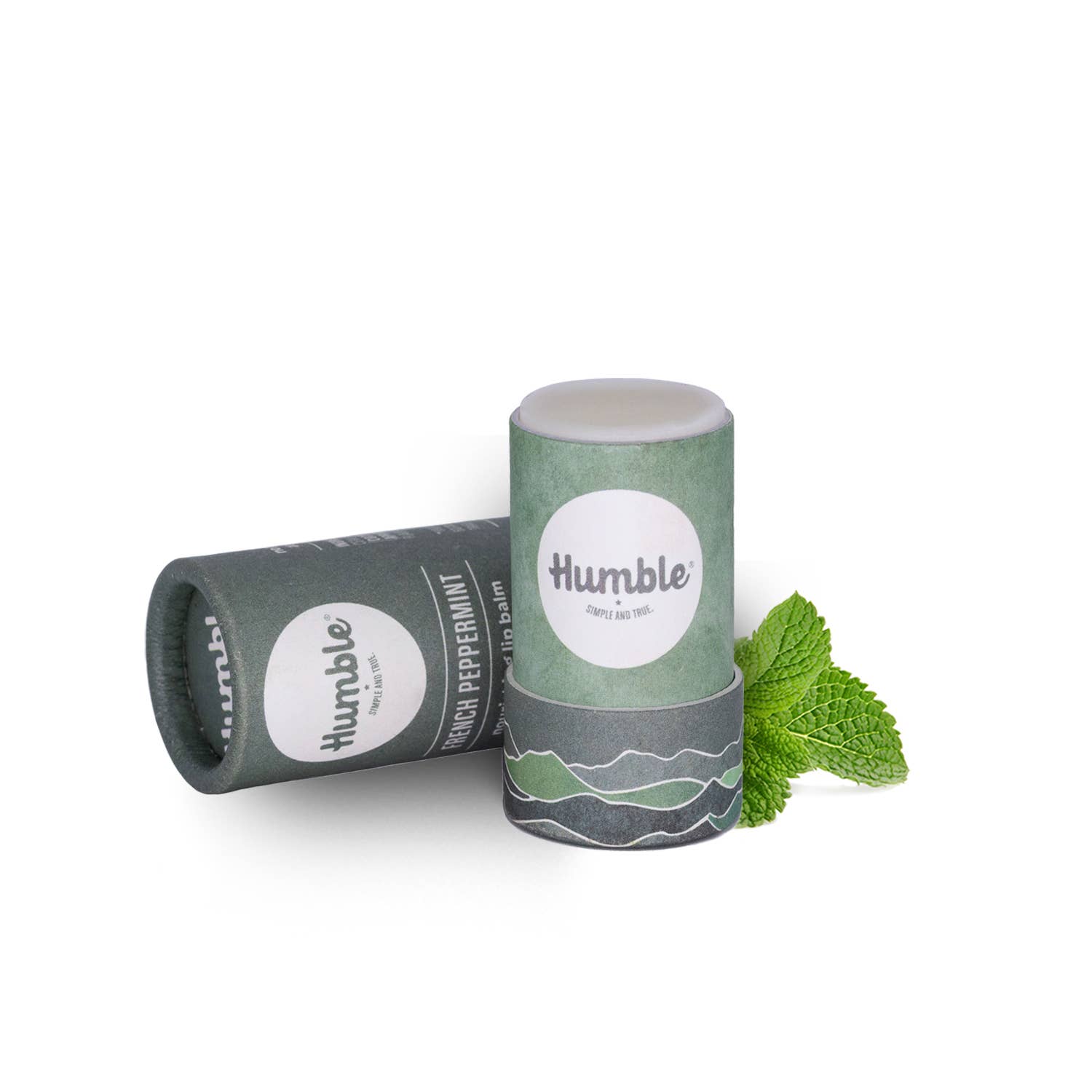 Two cylindrical lip balm containers with 'humble' branding on a white background.