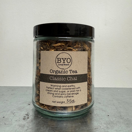 Jar of Organic Tea Classic Chai with a label on a gray surface