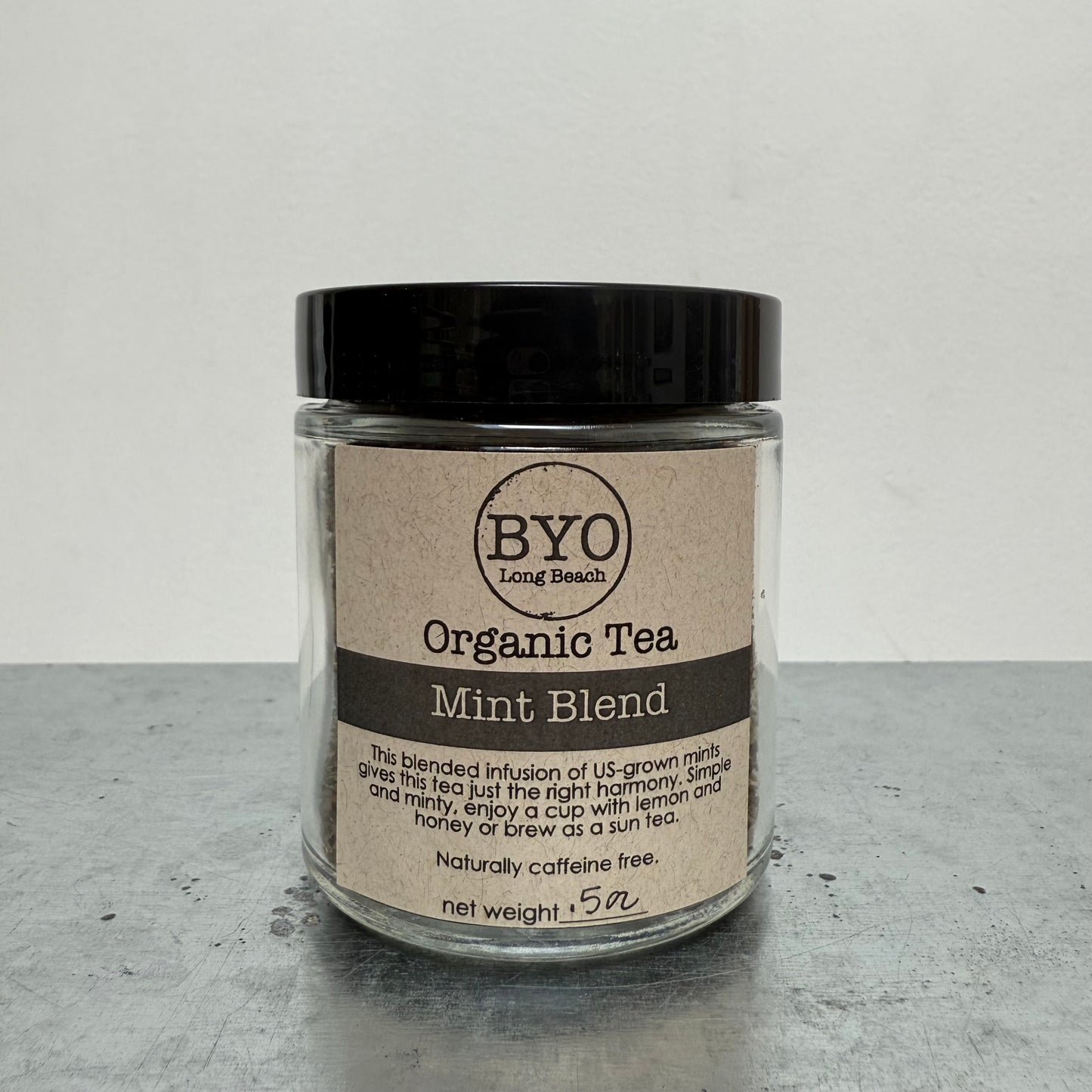 Jar of Organic Tea Mint Blend by BYO on a gray surface with a white background
