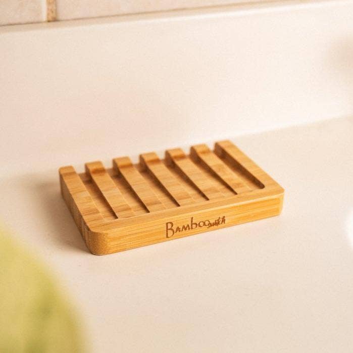 Bamboo soap dish on a bathroom counter 