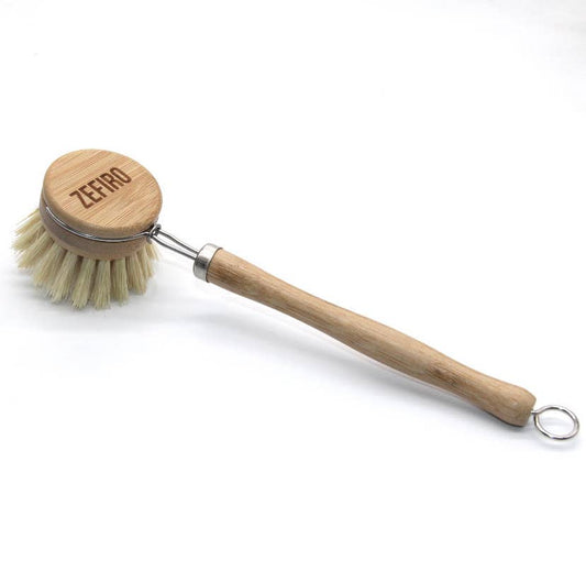 Dishwashing brush with wooden handle and bristle head on a white background