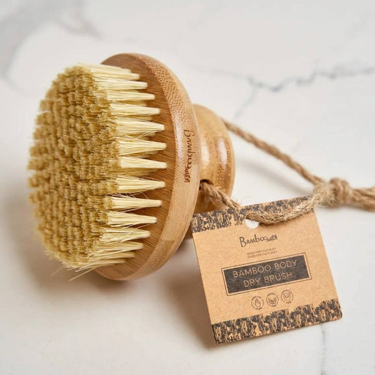 Bamboo body dry brush with a label on a light background