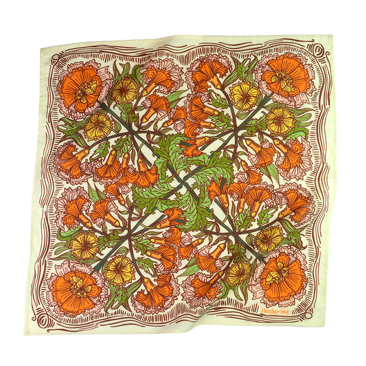 Floral patterned fabric with orange, green, and yellow flowers on a white background