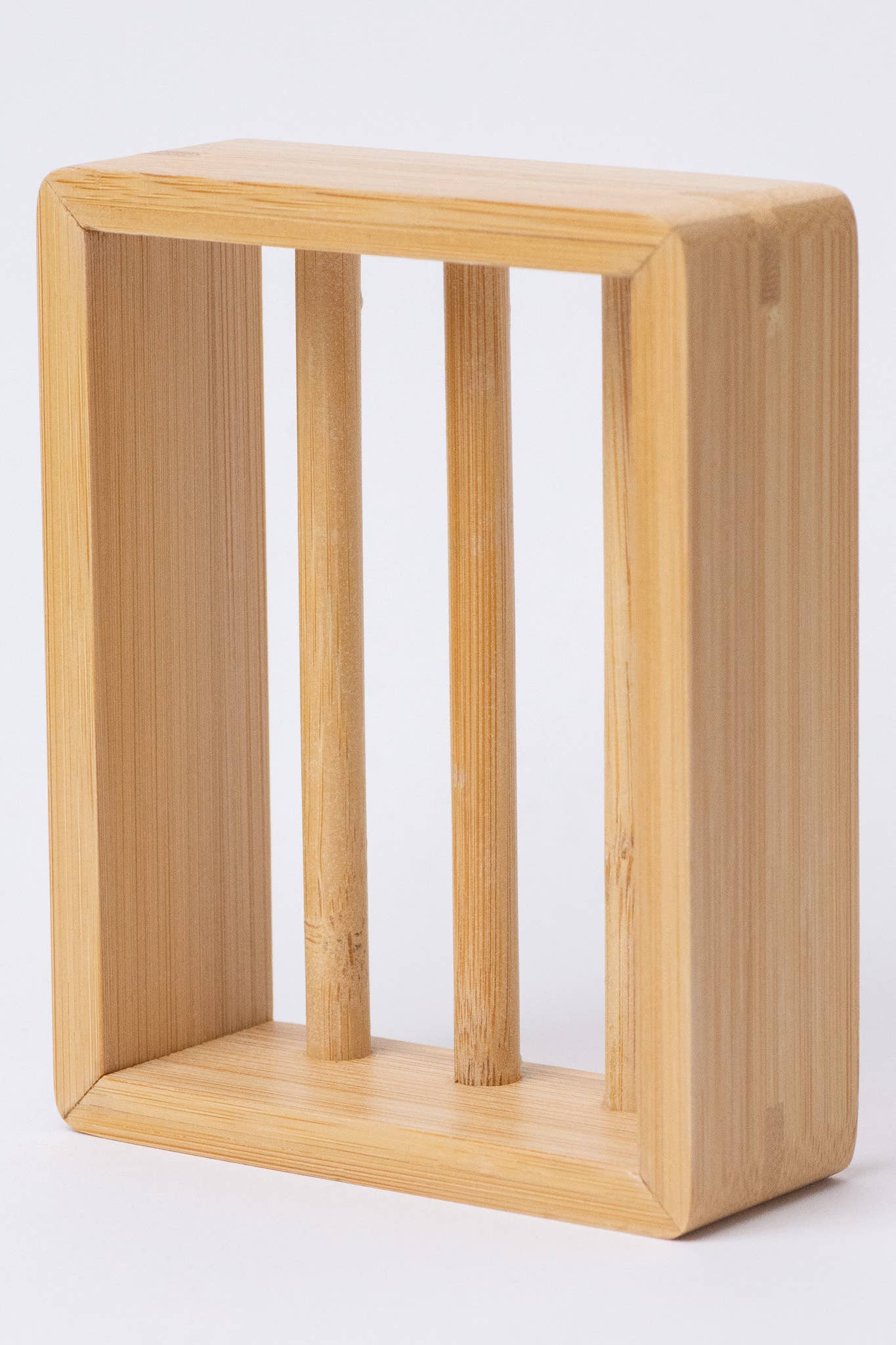 Wooden shelf with vertical slats on a white background
