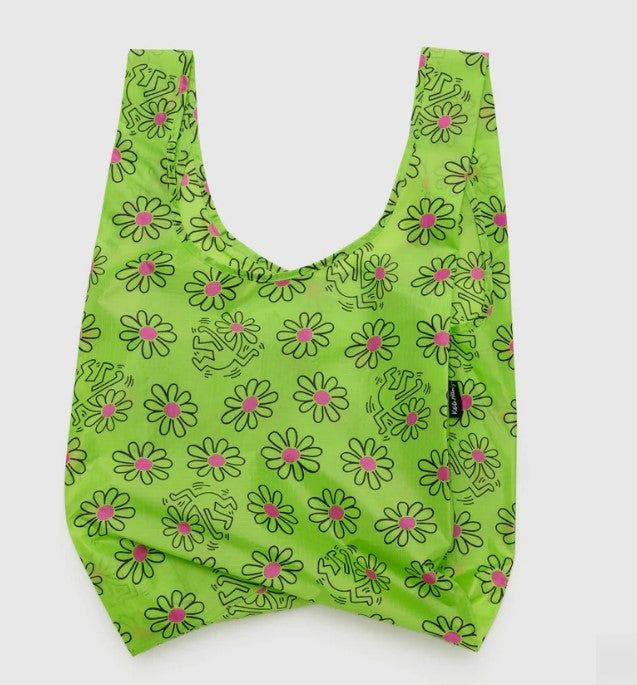 White background with nylon bag laying flat to show bright green background with hand drawn cartoon flower pattern