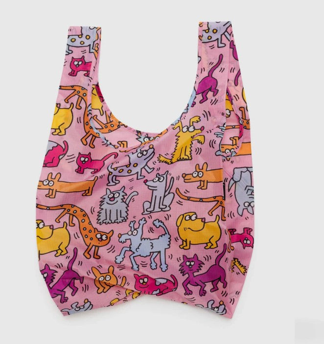 White background with nylon bag laying flat to show pink background with cartoonish looking dogs and cats pattern