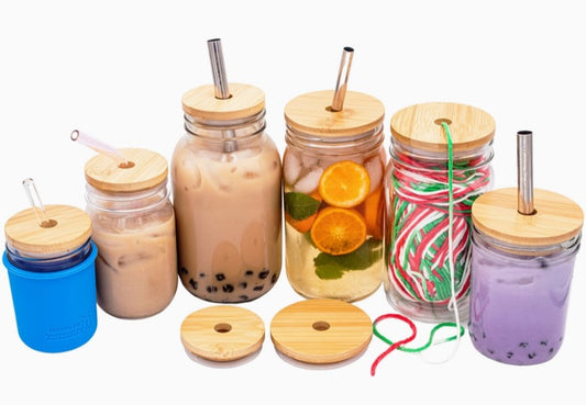 Variety of mason jars showing bamboo lids with a hole for straws