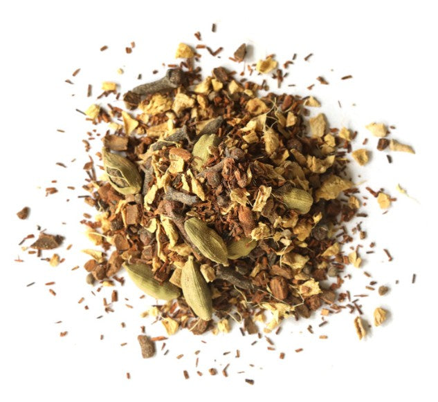 Spice blend with cardamom pods on a white background