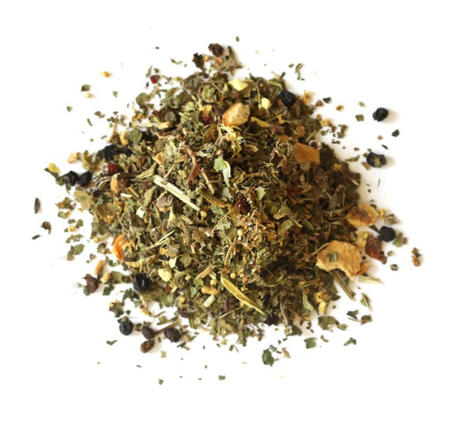 Heap of dried herbs on a white background