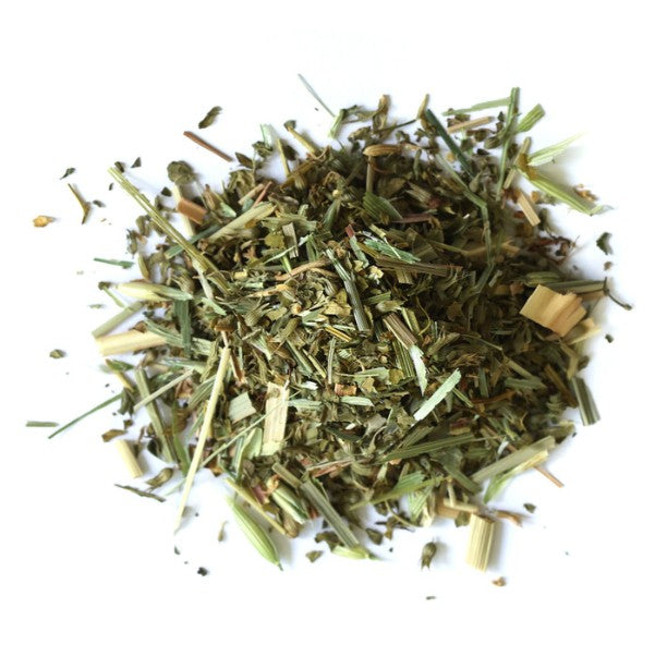 Heap of dried herbs on a white background