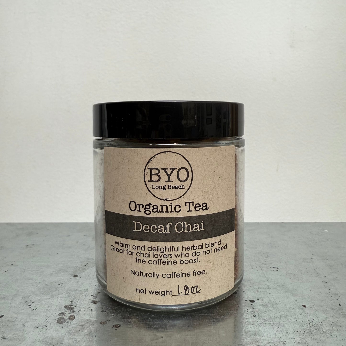 Jar of Organic Tea Decaf Chai by BYO on a gray surface with a white background