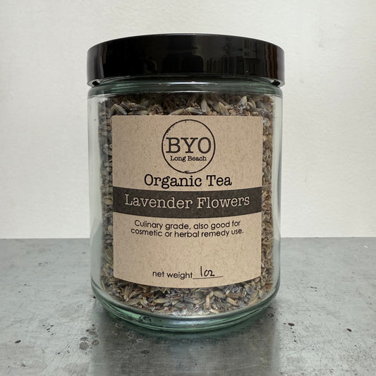 Jar of organic lavender flowers tea with a label on a gray surface