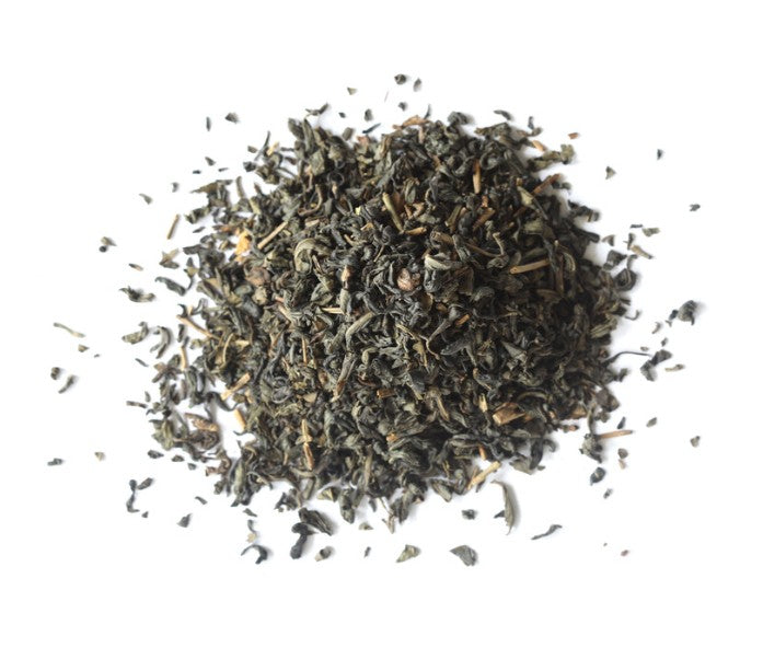 Dry tea leaves on a white background
