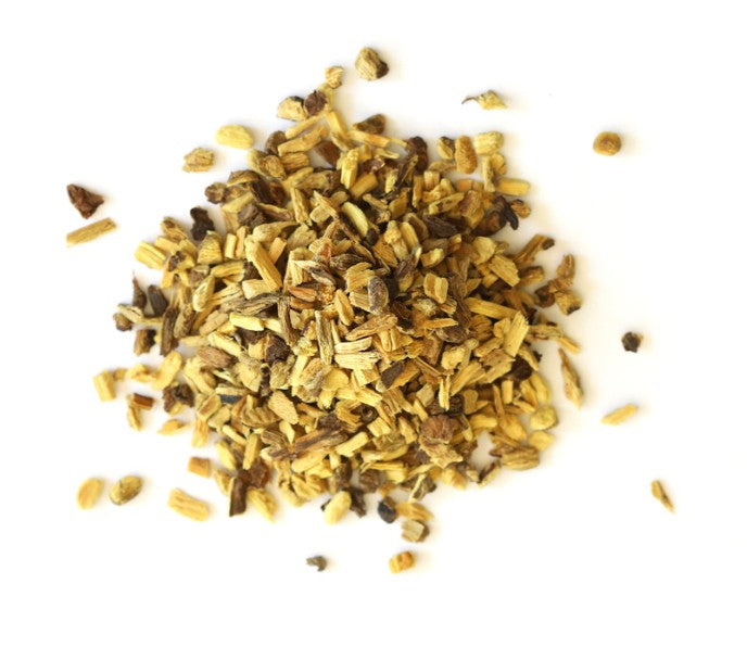 Heap of dried herbs on a white background