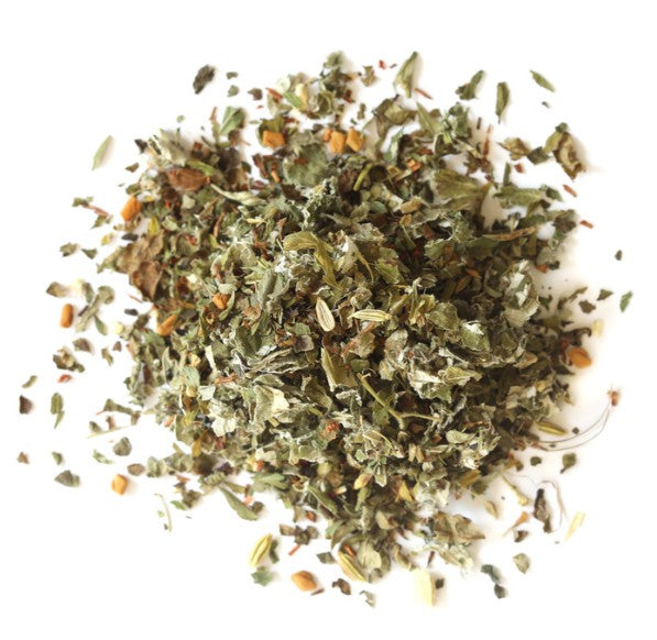 Pile of dried herbs on a white background
