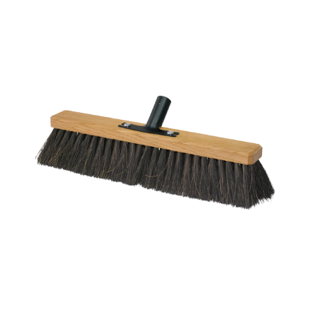 The image shows a broom head with black fibers and a wooden body on a white background.