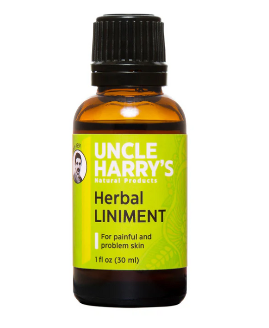 Bottle of Uncle Harry's Herbal Liniment on a white background