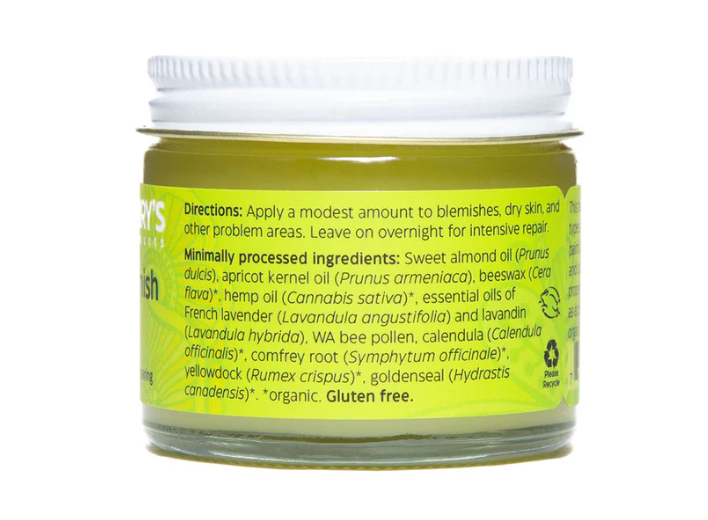 Jar of cream with green label and white lid on a white background