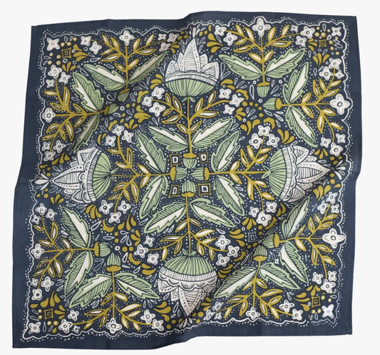 Floral patterned fabric with green, yellow, and white design on a blue background