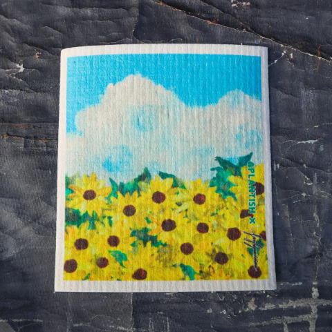 Small painted sunflower field on a textured black surface