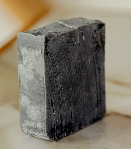Rustic black bar soap shown for texture