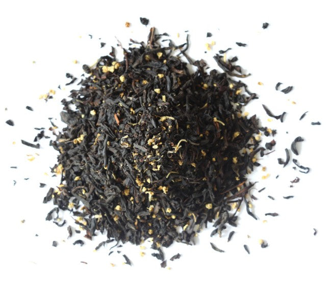 Dry black tea leaves on a white background
