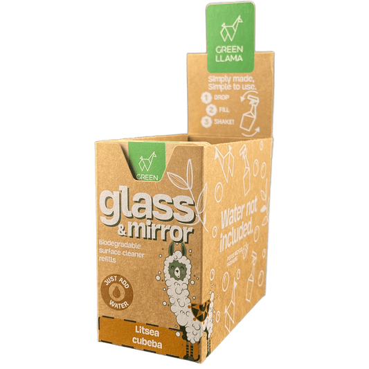Box of glass and mirror cleaner with green label on a black background