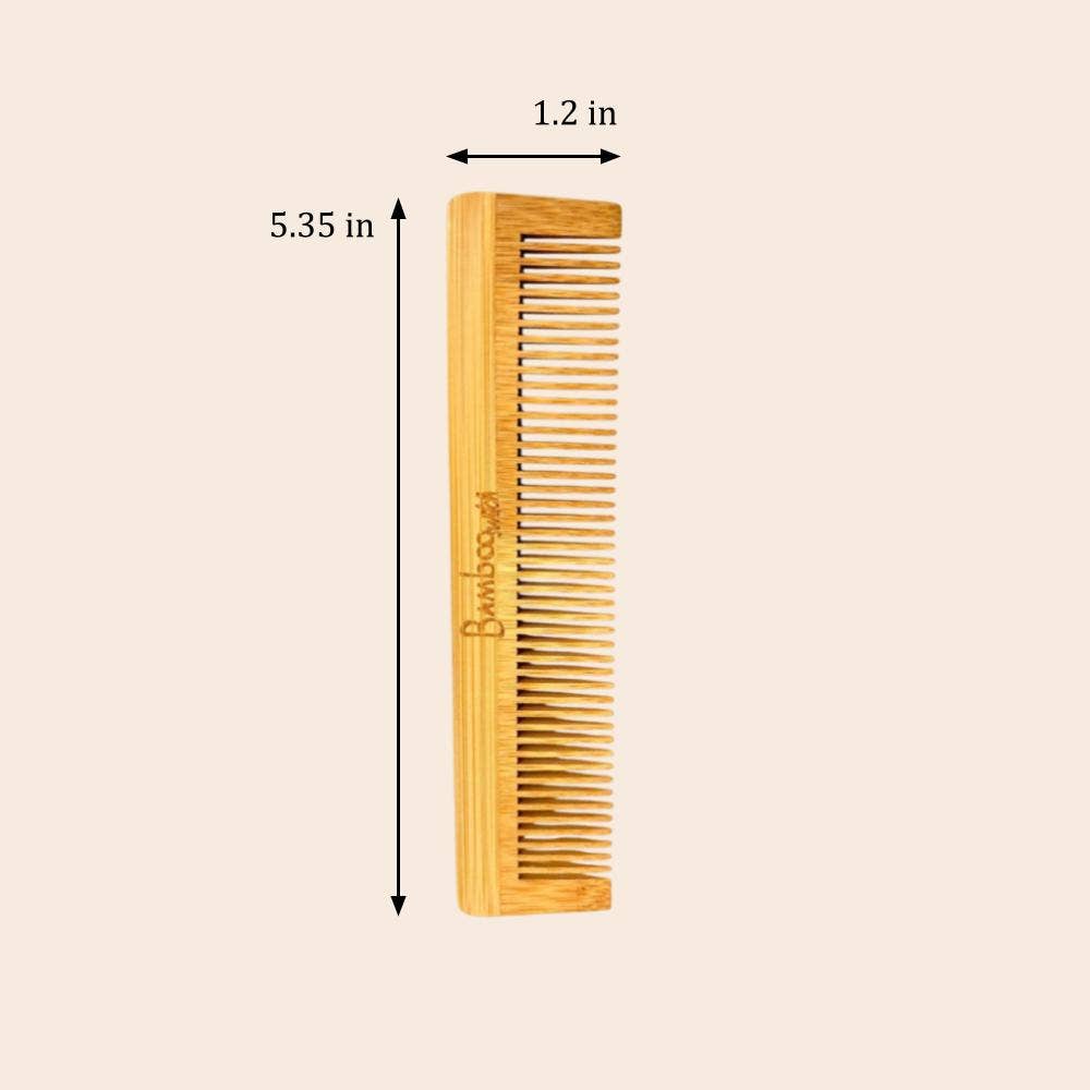 Wooden comb with measurements on a beige background