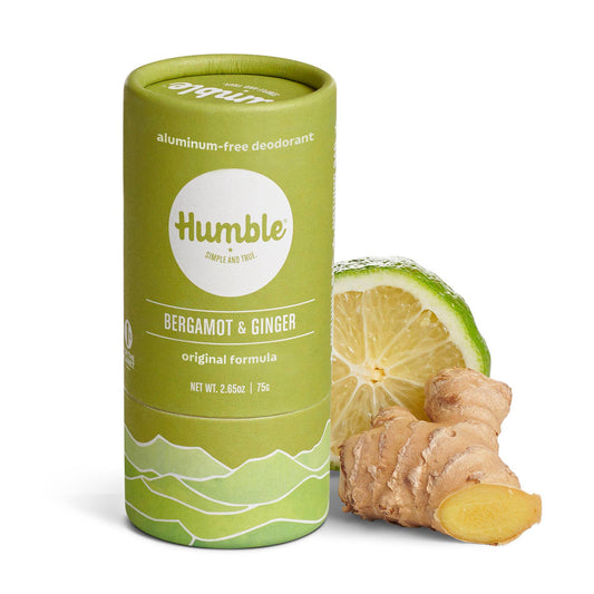 Green cylindrical Humble deodorant container with bergamot and ginger on a white background