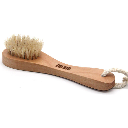 Wooden brush with bristles and rope handle on a white background