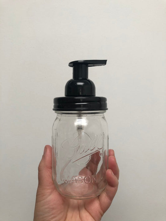 A Mason jar with a black foaming pump top and a regular mouth.